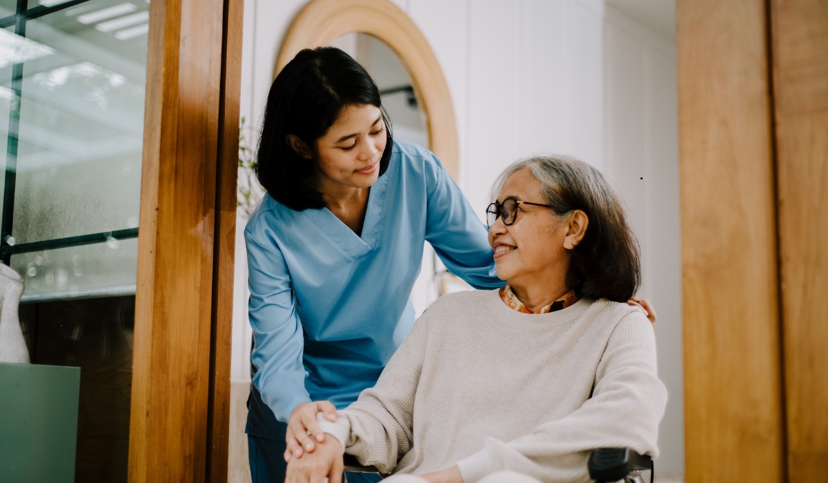 Elderly woman receiving compassionate medical care from a nurse at Lamset Haya Elderly Care